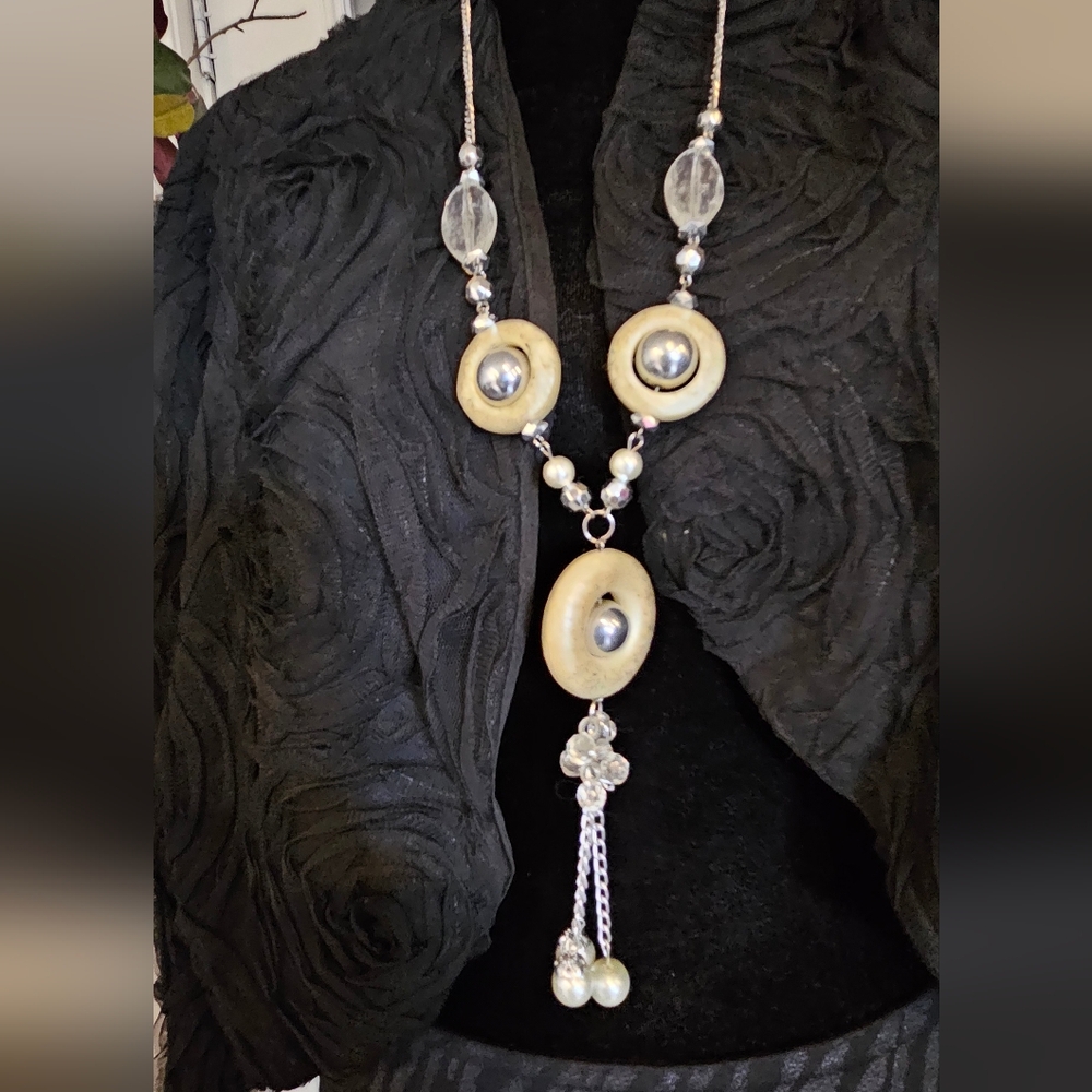 Long silver-tone pendant necklace with a graceful Y-drop
